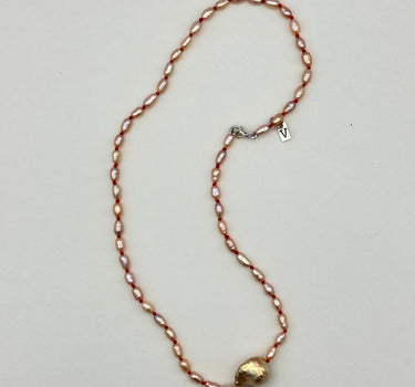 Pink pearl necklace with baroque sea pearl.