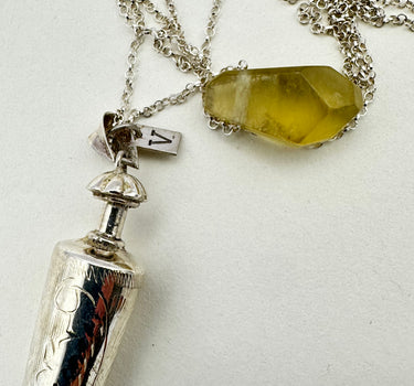 Antique carved silver perfume bottle with yellow morganite
